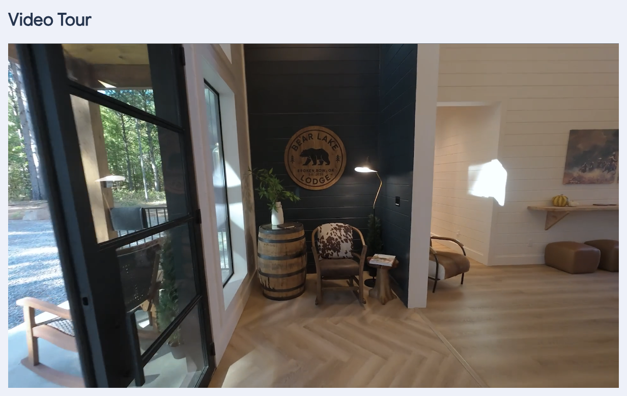 A property page showing the Video Tour heading and a silent looping walkthrough video below the gallery